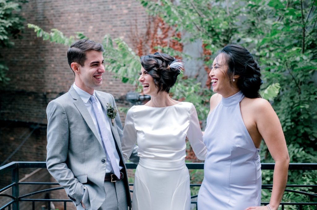 Two brides wearing white dresses for their wedding in Brooklyn