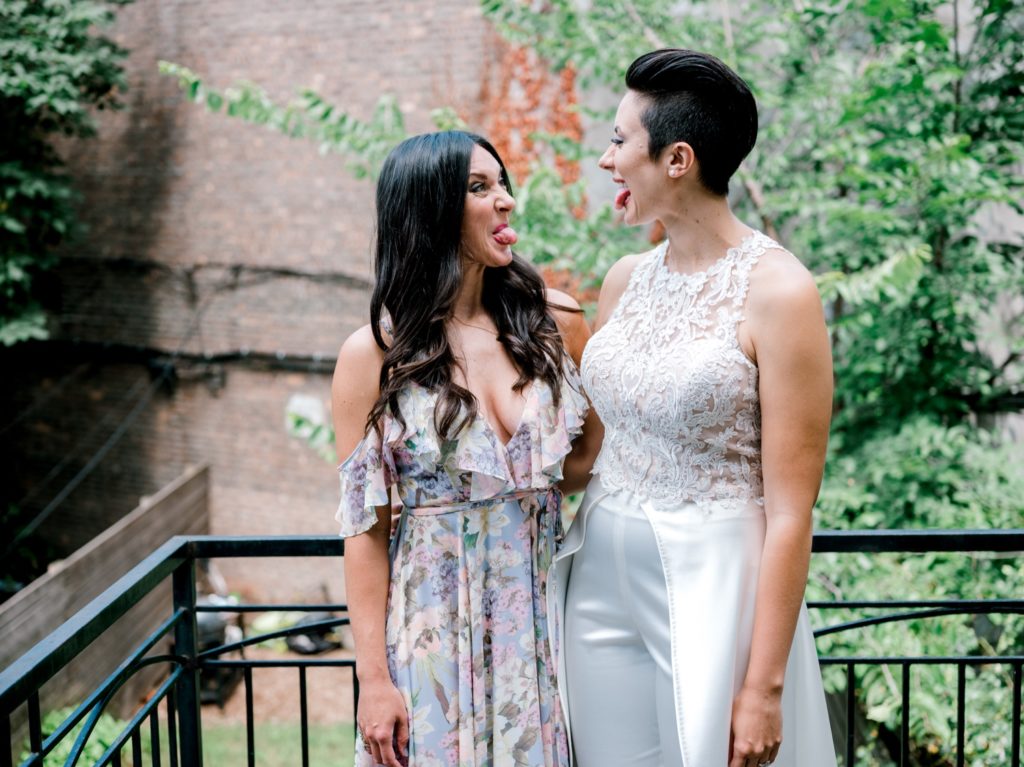 Two brides wearing white dresses for their wedding in Brooklyn