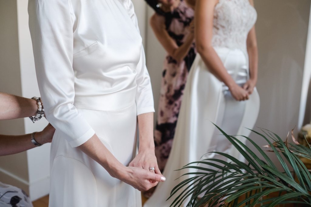 Two brides in white gowns for wedding in Brooklyn