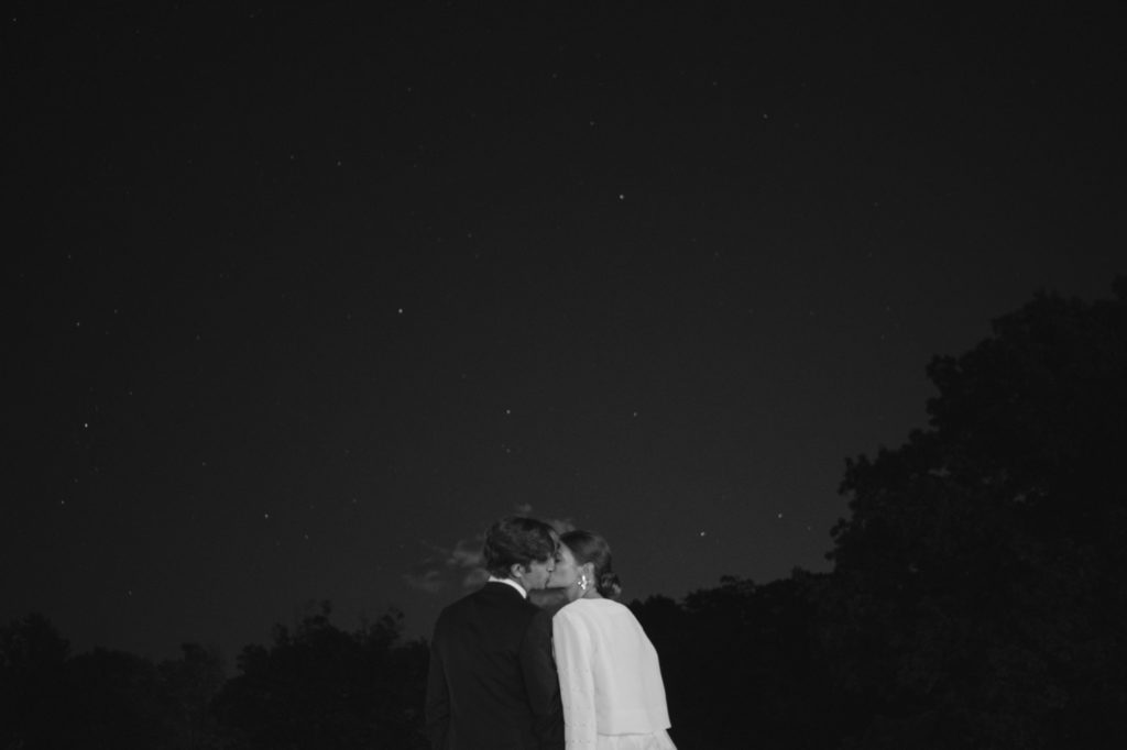 Couple under the stars at night on their wedding day