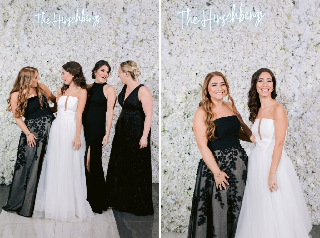 Wedding party portraits in front of flower wall