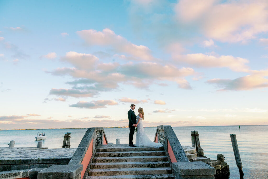 Sunset Bride and groom photo at the dock stairs at Vizcaya Museum.