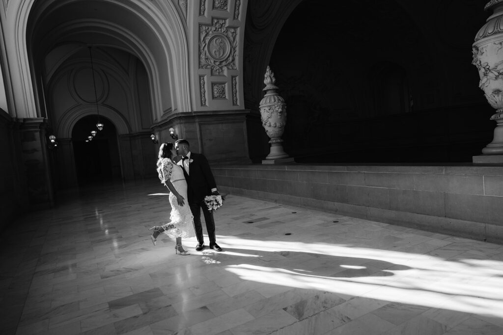 Black and white bride and groom portrait at San Francisco City Hall. 
