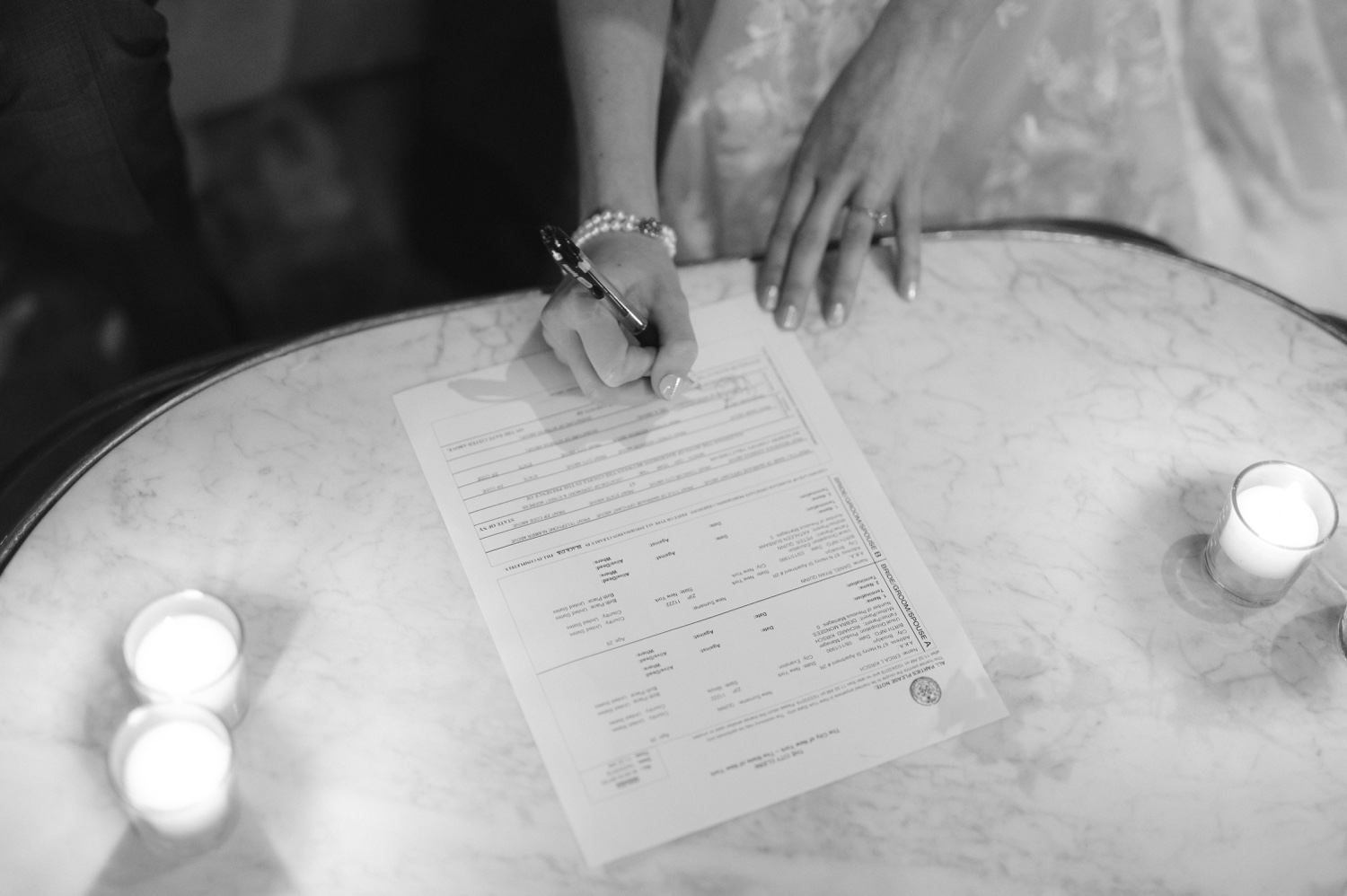 A couple signing marriage license at The Foundry
