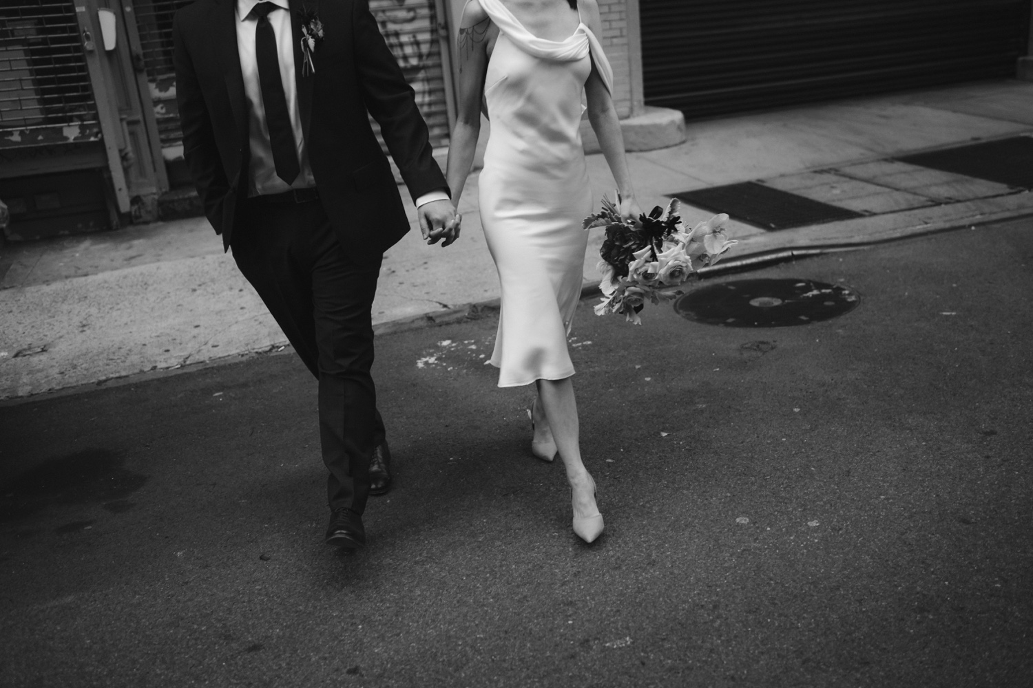 Stylish couple walking streets of NYC during wedding photos
