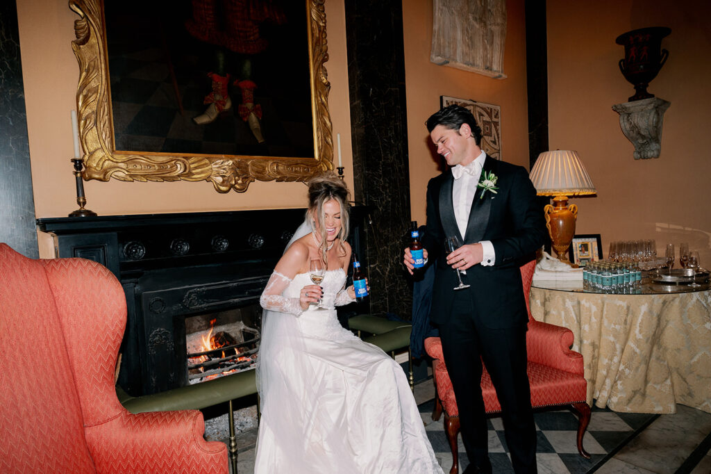 Bride and groom sharing a beer after their wedding ceremony at Ballyfin Demesne.