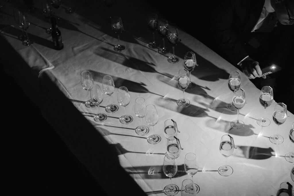 Artistic black and white photos of empty glasses at cocktail hour.