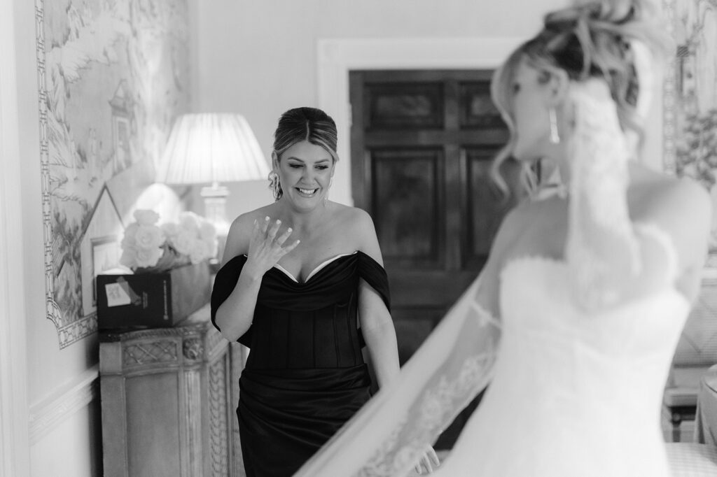 Emotional bride and bridesmaid first look.