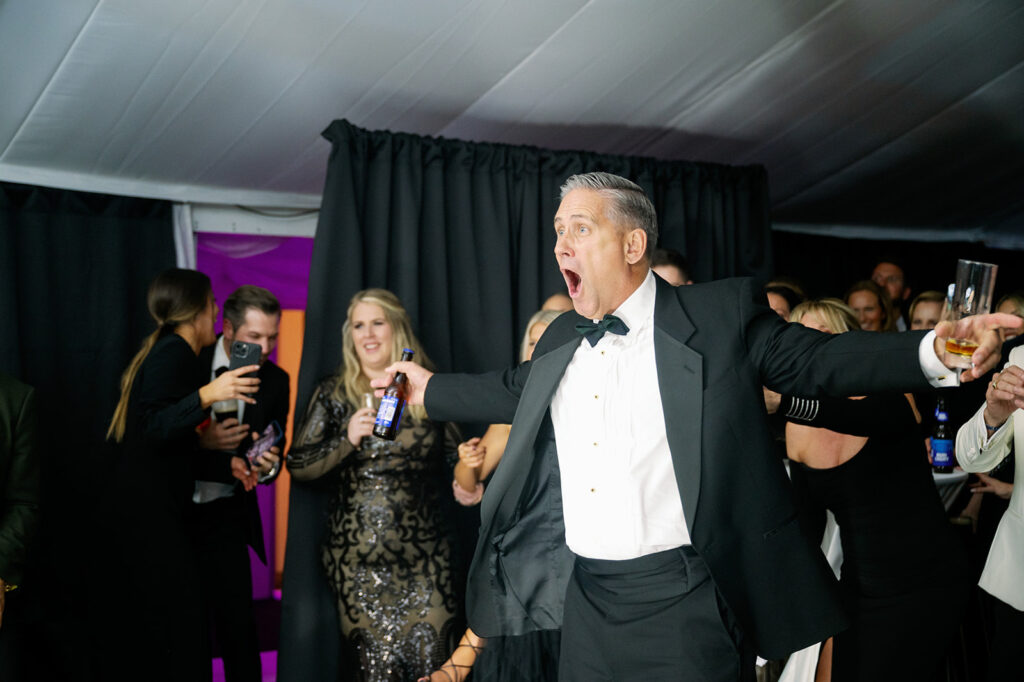 Bride's dad shocked as he sees a surprise Elvis impersonator at the reception.