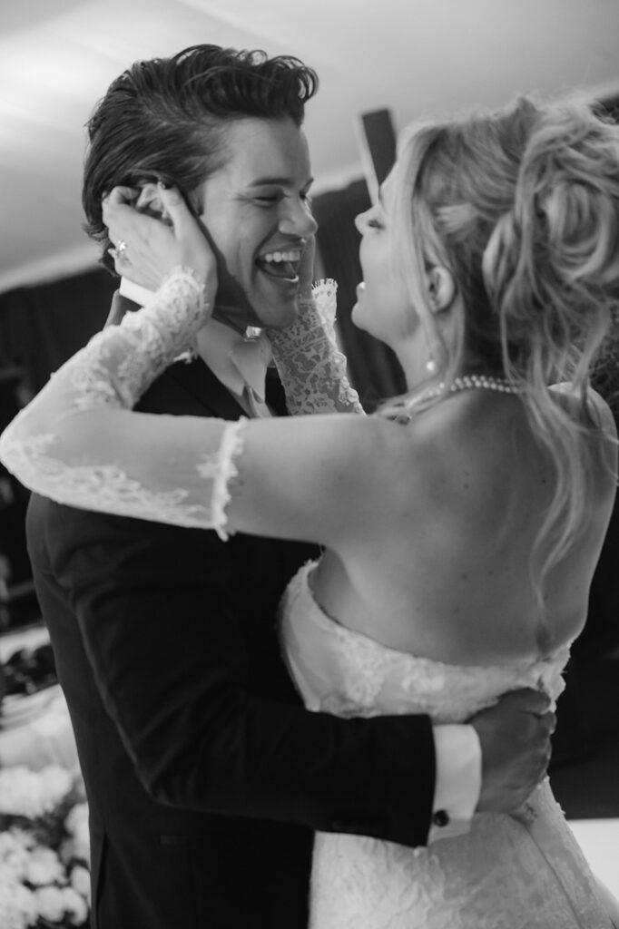 Bride and groom smiling during their first dance.