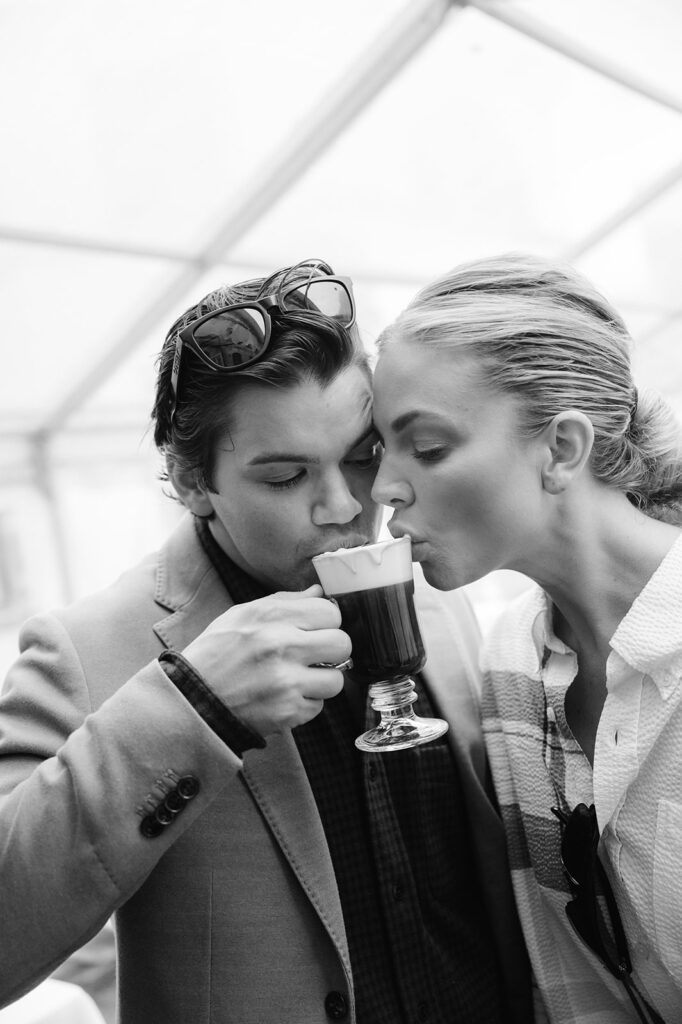 Couple sipping on a cup of traditional Irish coffee.