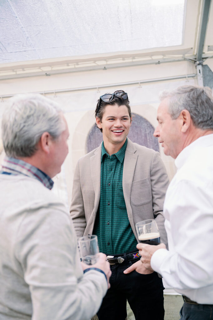 Groom mingling with guests at his morning after goodbye brunch.
