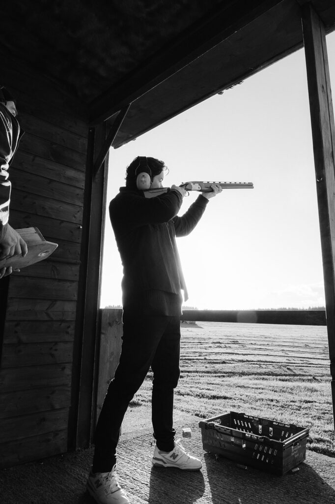 A man shooting a clay pigeon at Ballyfin Demesne.