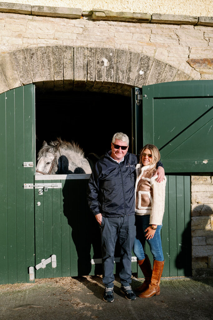 A couple standing outside the stable at Ballyfin Demesne.