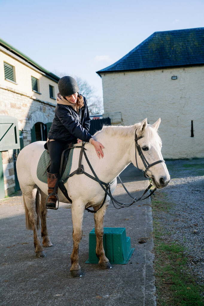 A woman on a horse at the Ballyfin Demesne stables.