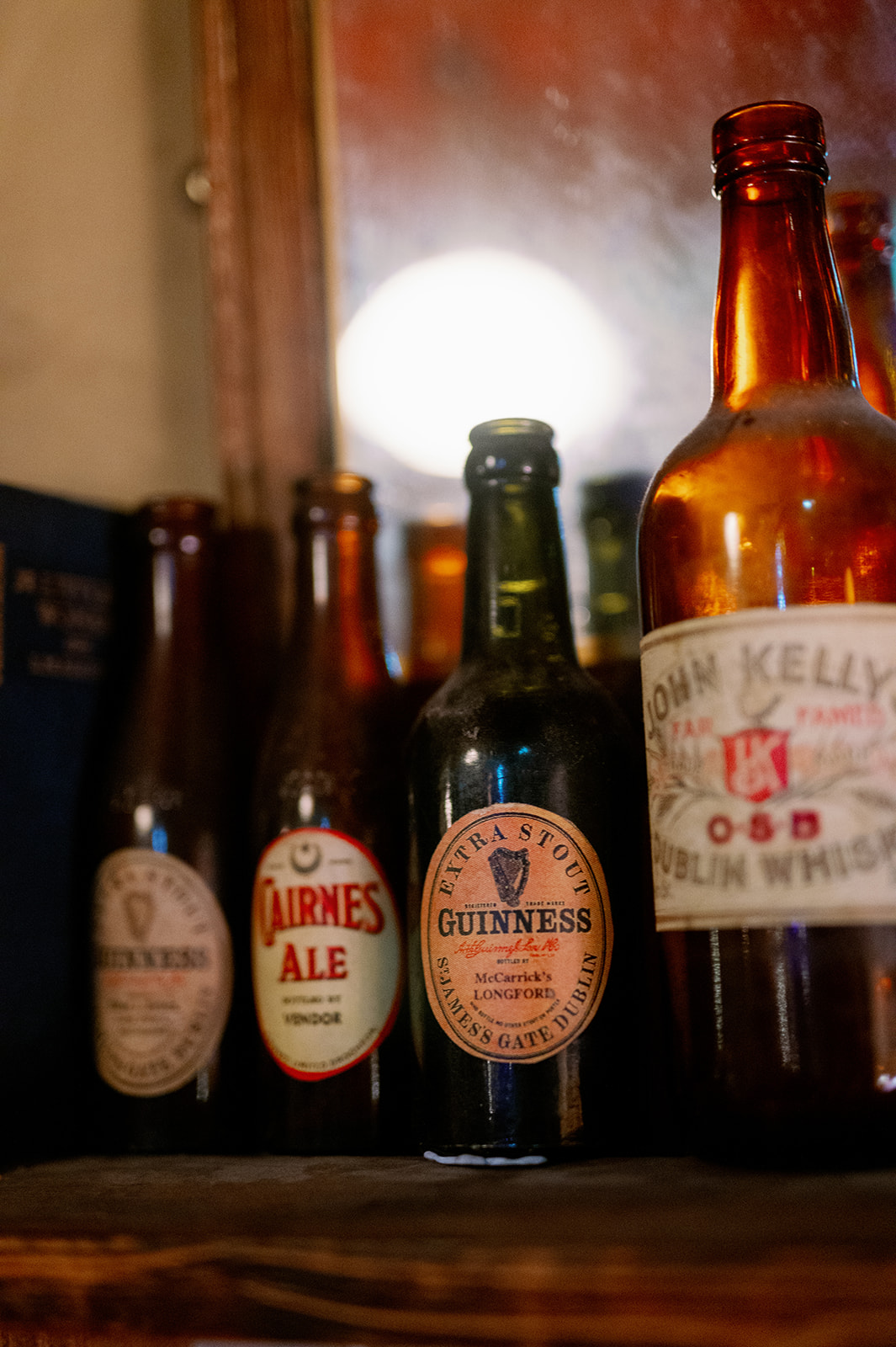 Four glass bottles of Irish beer.