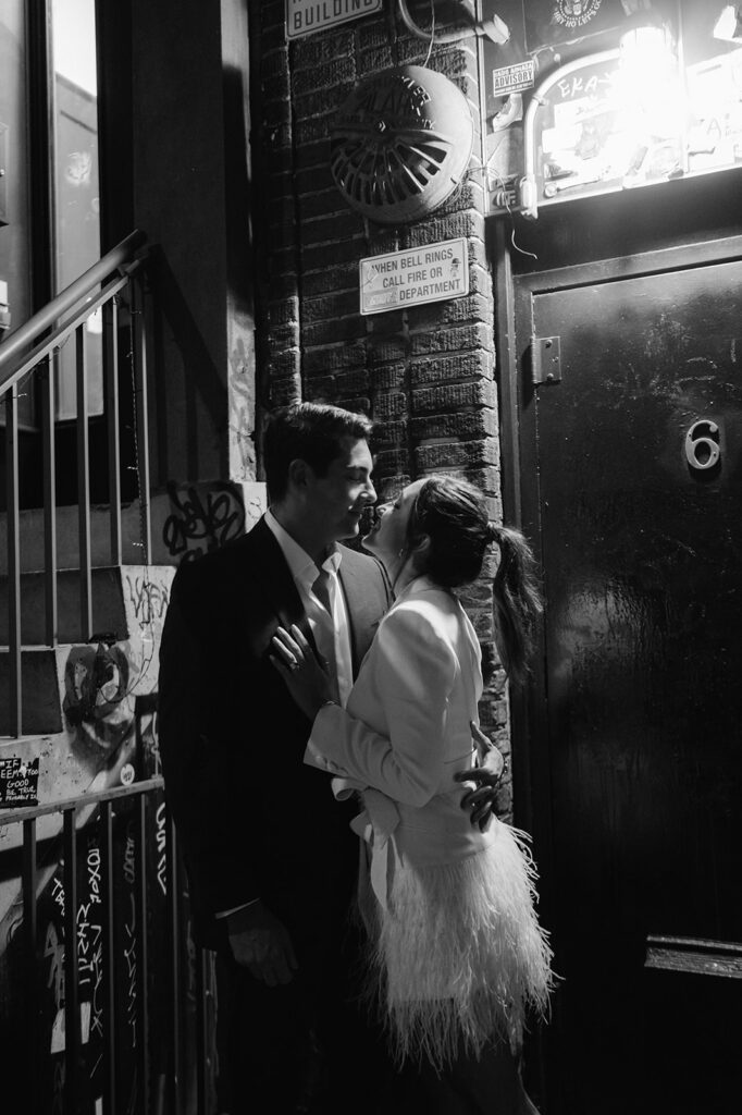 Candid moment between a couple against an urban backdrop in East Village, New York. 