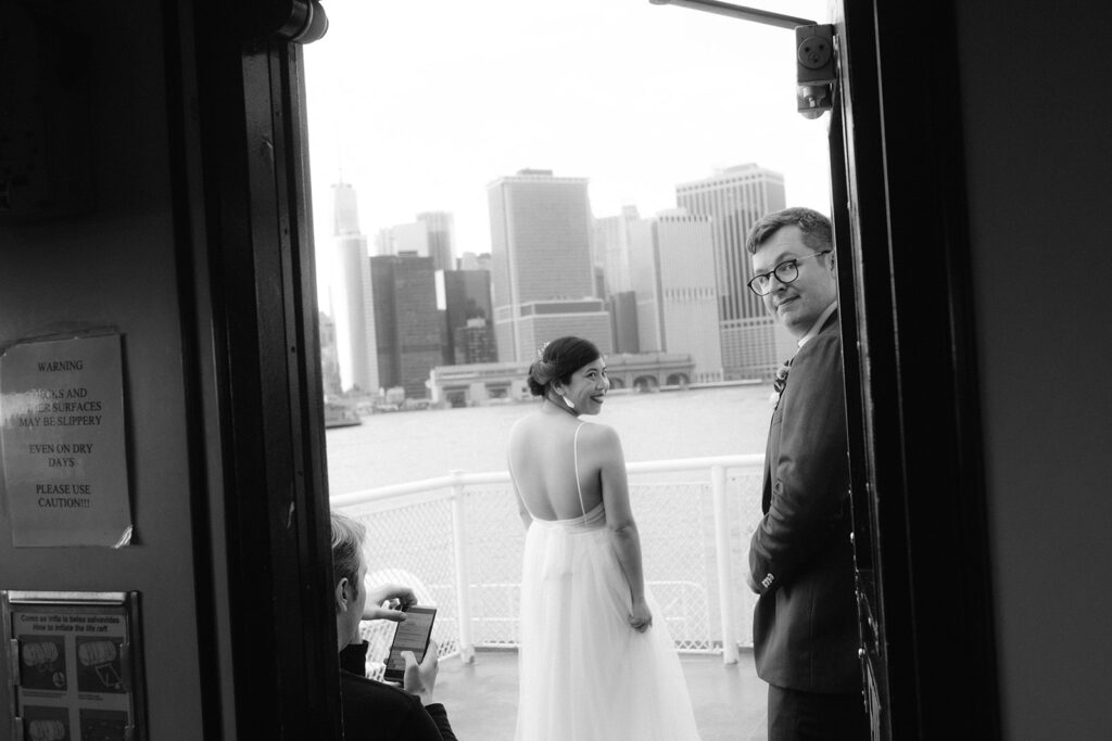 Candid shot of a couple riding a ferry boat after their New York City elopement.