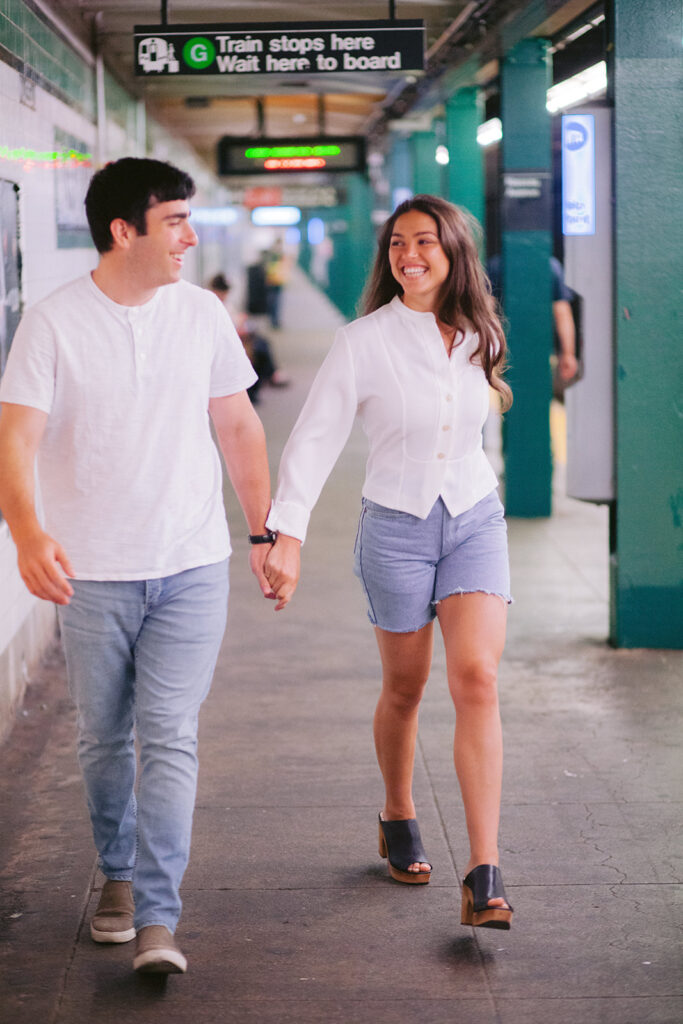 Cute couples casual engagement photos in a New York City subway station. 