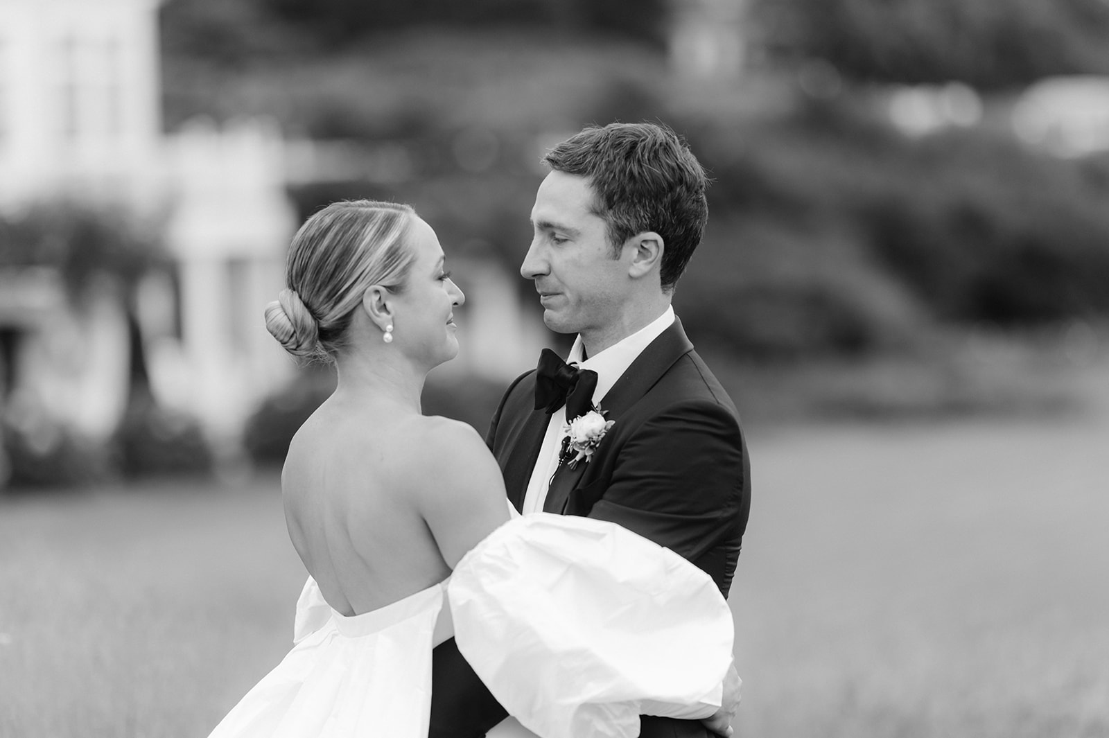 An emotional black and white photo of a bride and groom after their first look.