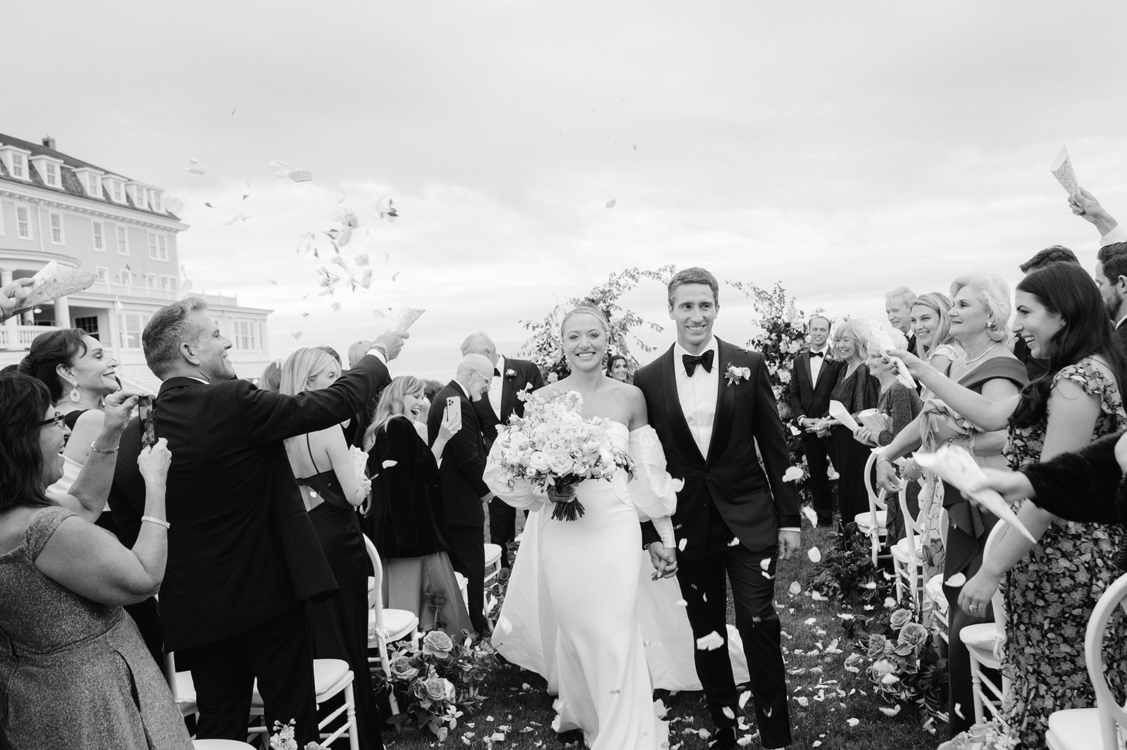 Black and white wedding ceremony recessional and petal toss. 