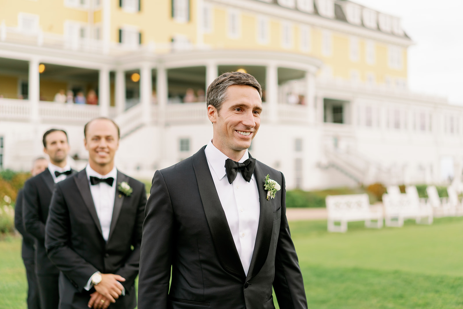Groom and groomsmen processional on the lawn of Ocean House in Rhode Island.