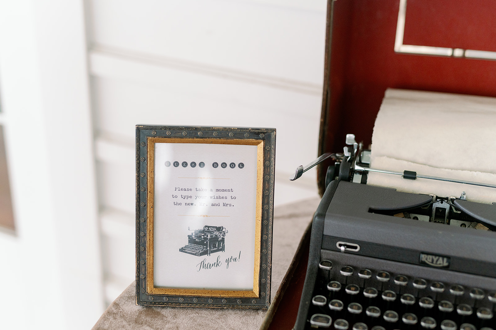 Wedding guest book sign for a vintage typewriter where guests can leave their well-wishes for the couple. 