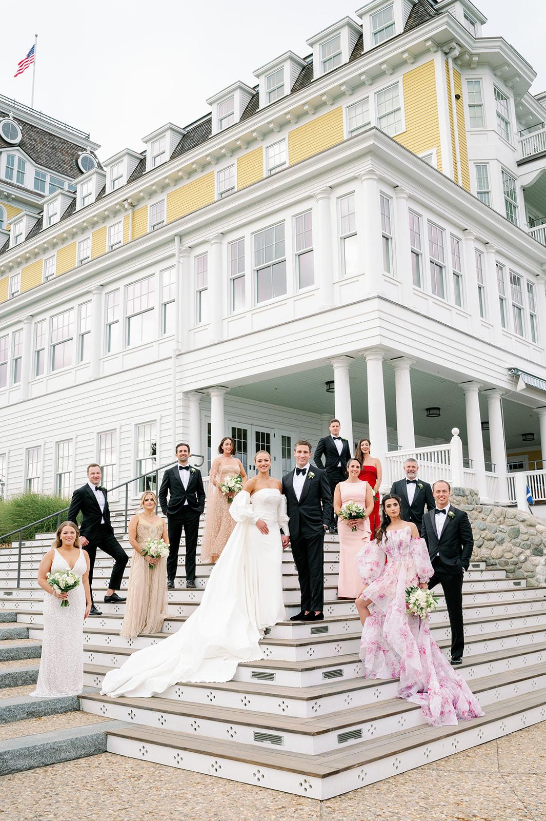 Posed editorial wedding party portrait on the steps of Ocean House in Rhode Island.  