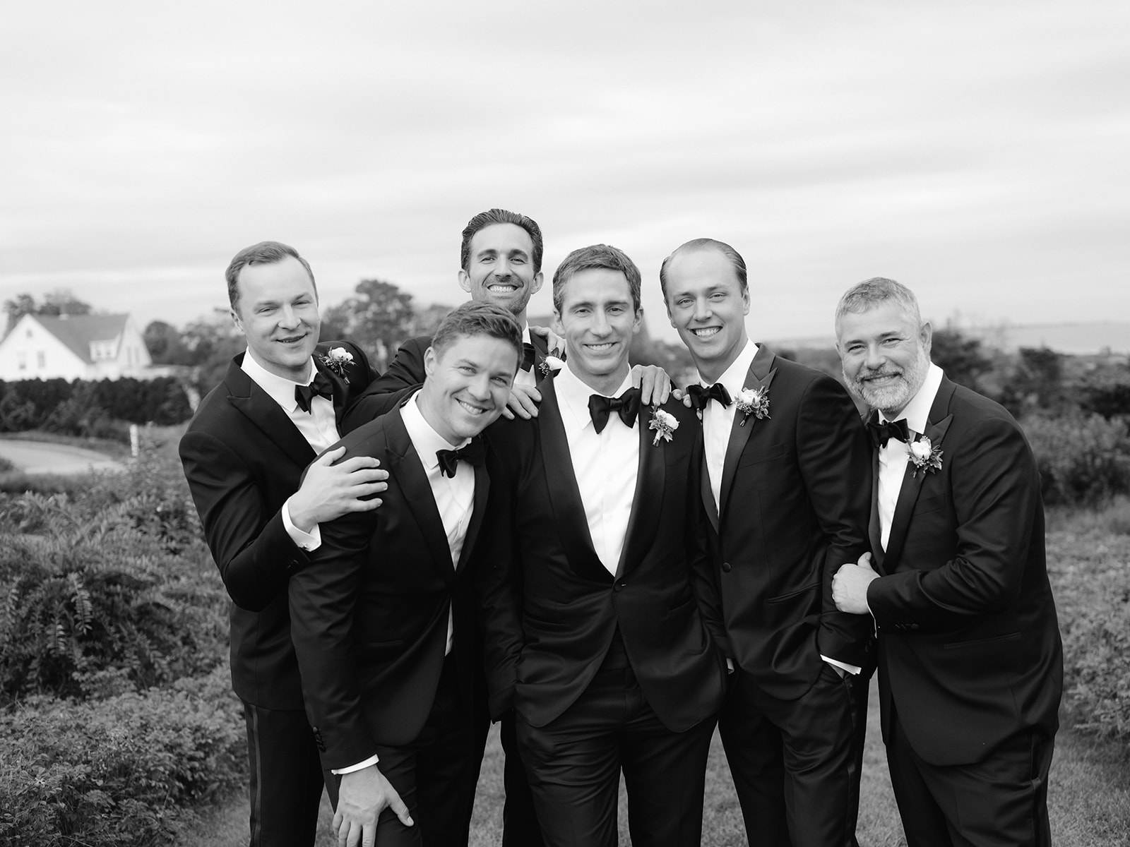 Black and white fine art wedding portrait of a groom and five groomsmen in Rhode Island. 