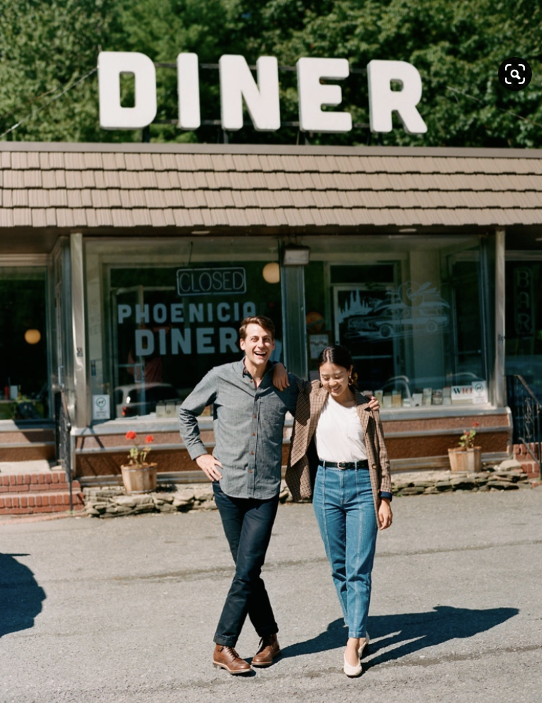 Couple sharing a candid moment outside the Phoenicia Diner in the Catskills in the Hudson Valley.
