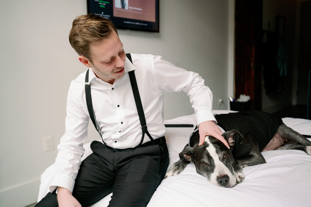 Katherine Marchand Photography Tips to Include Your Pet in your Wedding Groom Getting Ready with his Dog