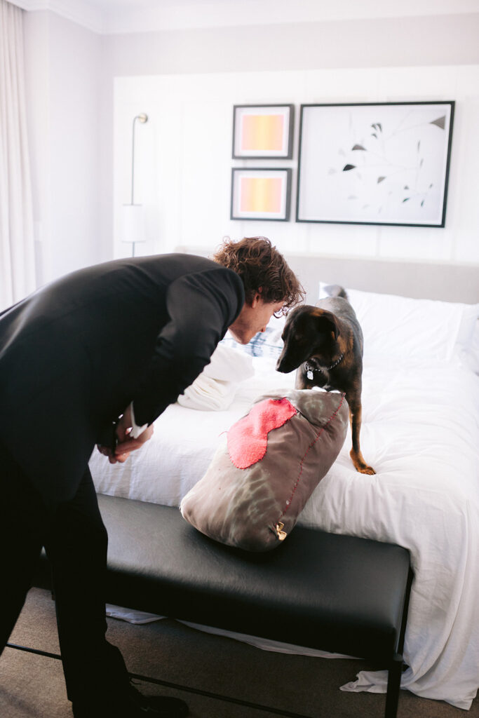 Katherine Marchand Photography Tips to Include Your Pet in your Wedding Groom Getting Ready with his Dog