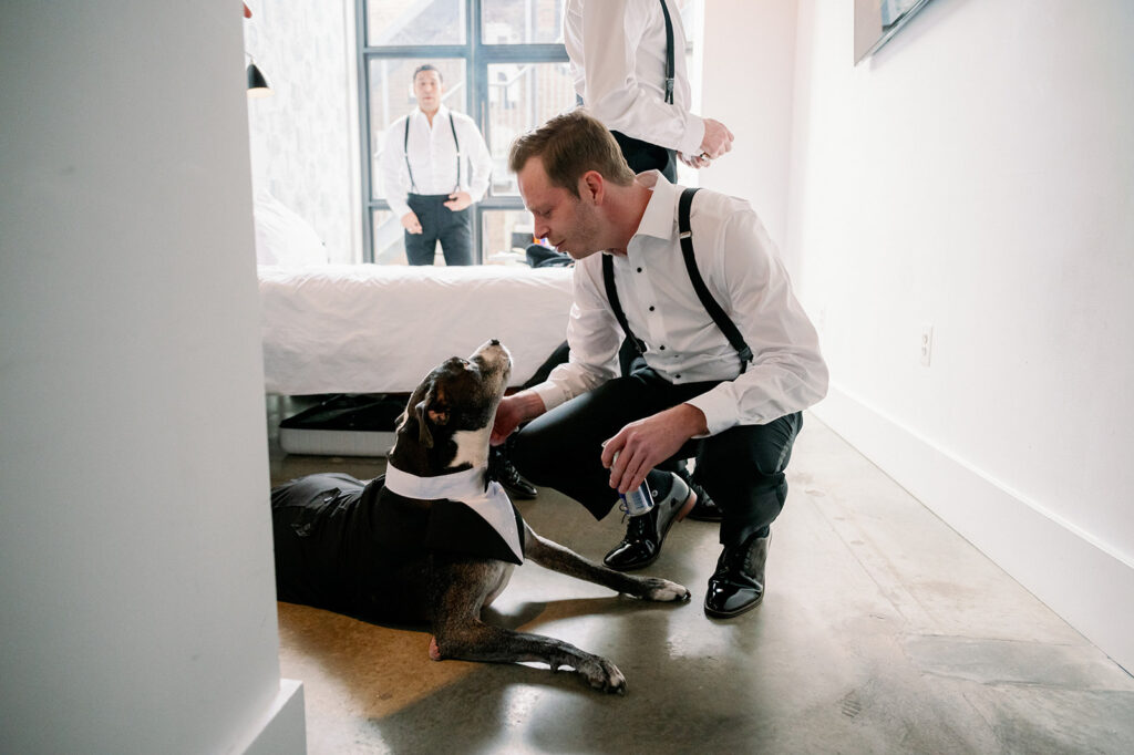 Katherine Marchand Photography Tips to Include Your Pet in your Wedding groom petting his dog