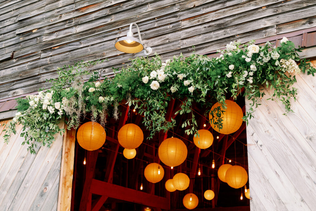 Romantic barn wedding warm pendant lights. 