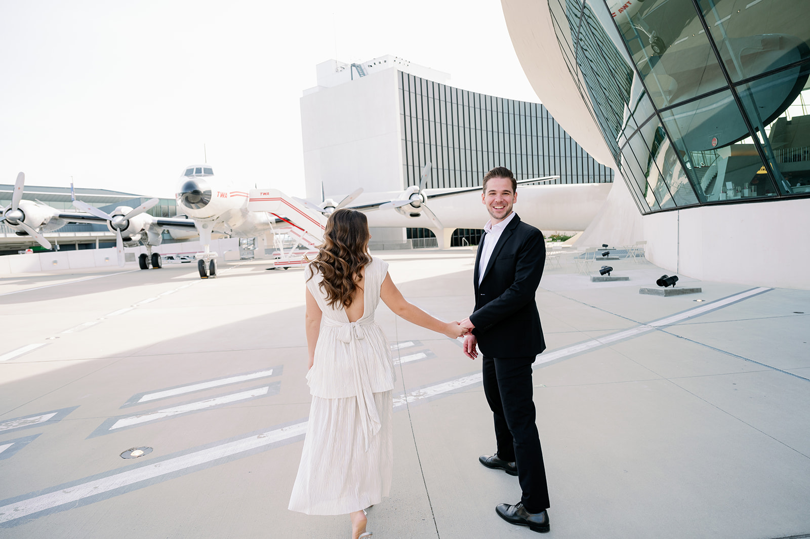 Engagement session on the tarmac at TWA Hotel.