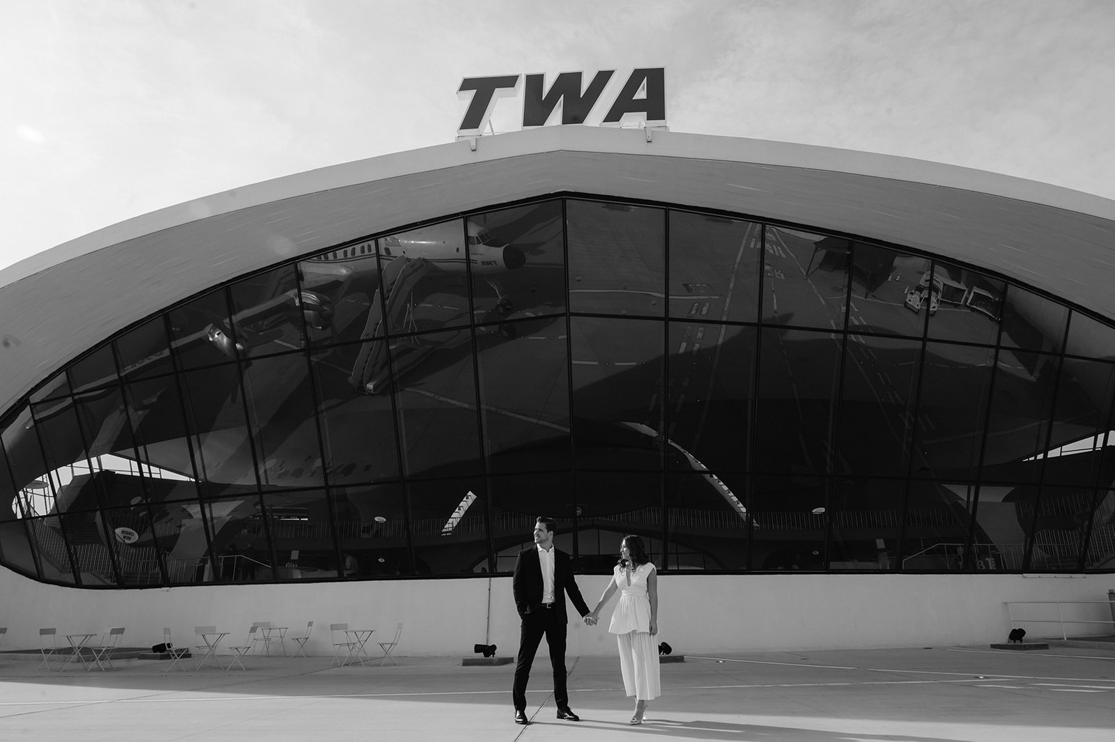 Retro documentary-style engagement photos at TWA Hotel.
