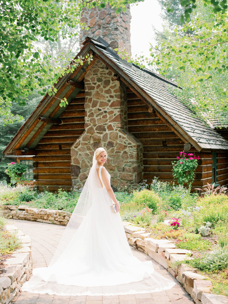Wedding in Sun Valley, Idaho bride portraits with Trail Creek Cabin in the background.