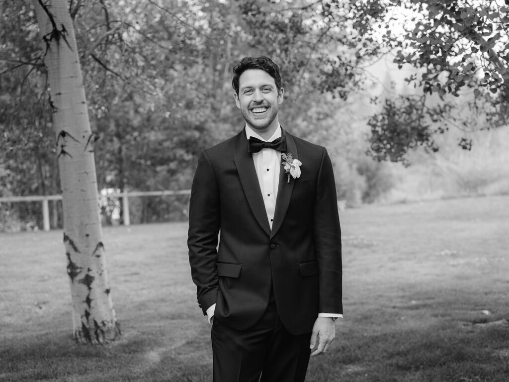 Black and white groom portrait.