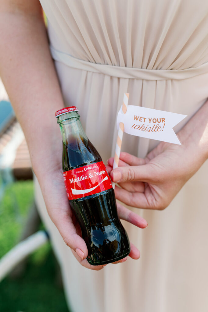 Wedding cocktail hour personalized Coke bottles.