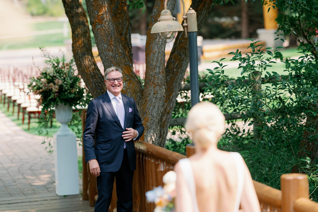 Sweet father-daughter first look during a wedding in Sun Valley, Idaho.