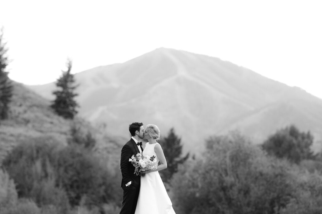 Black and white bride and groom portrait against the Idaho mountains.