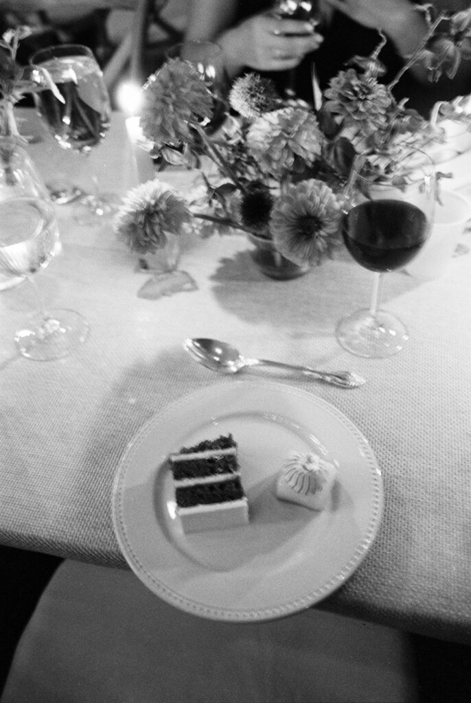 Wedding reception cake slice.