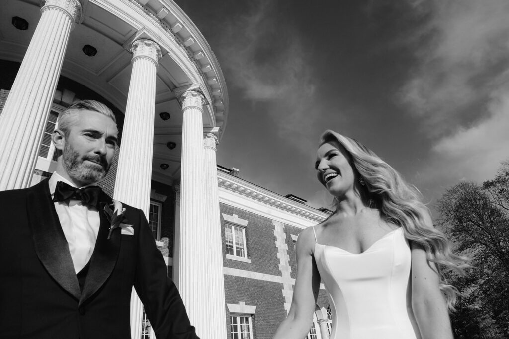 Candid bride and groom portrait outside the Bourne Mansion.