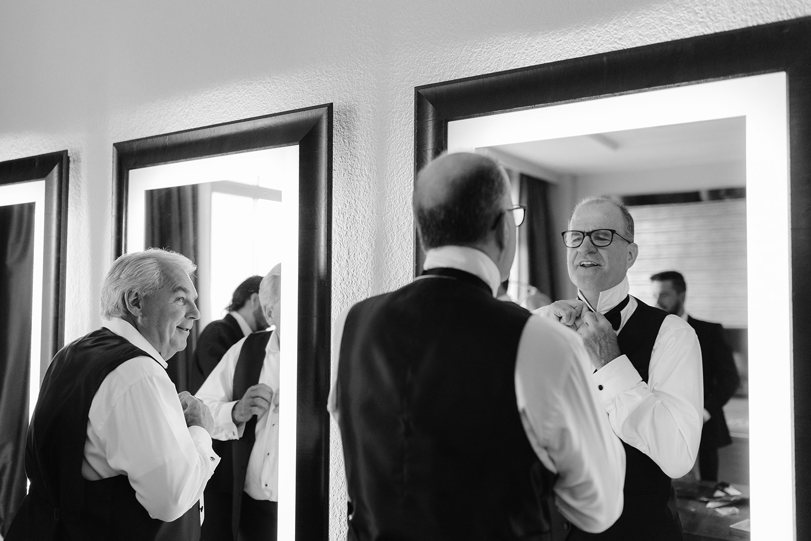 Bride and groom's fathers getting ready at Hyatt Regency Hotel.