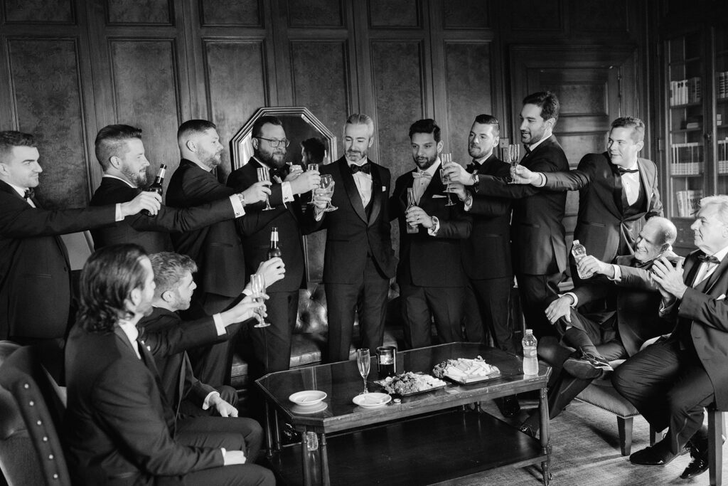 Groomsmen toast in the Groom's room at the Bourne Mansion.