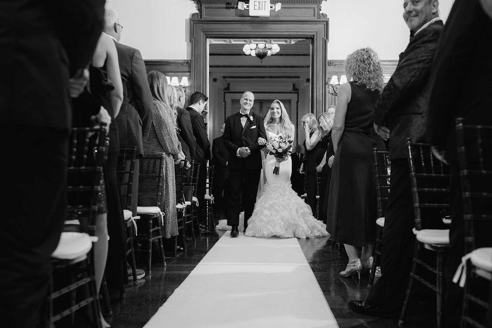 Bourne Mansion indoor wedding ceremony bride walking down the aisle.