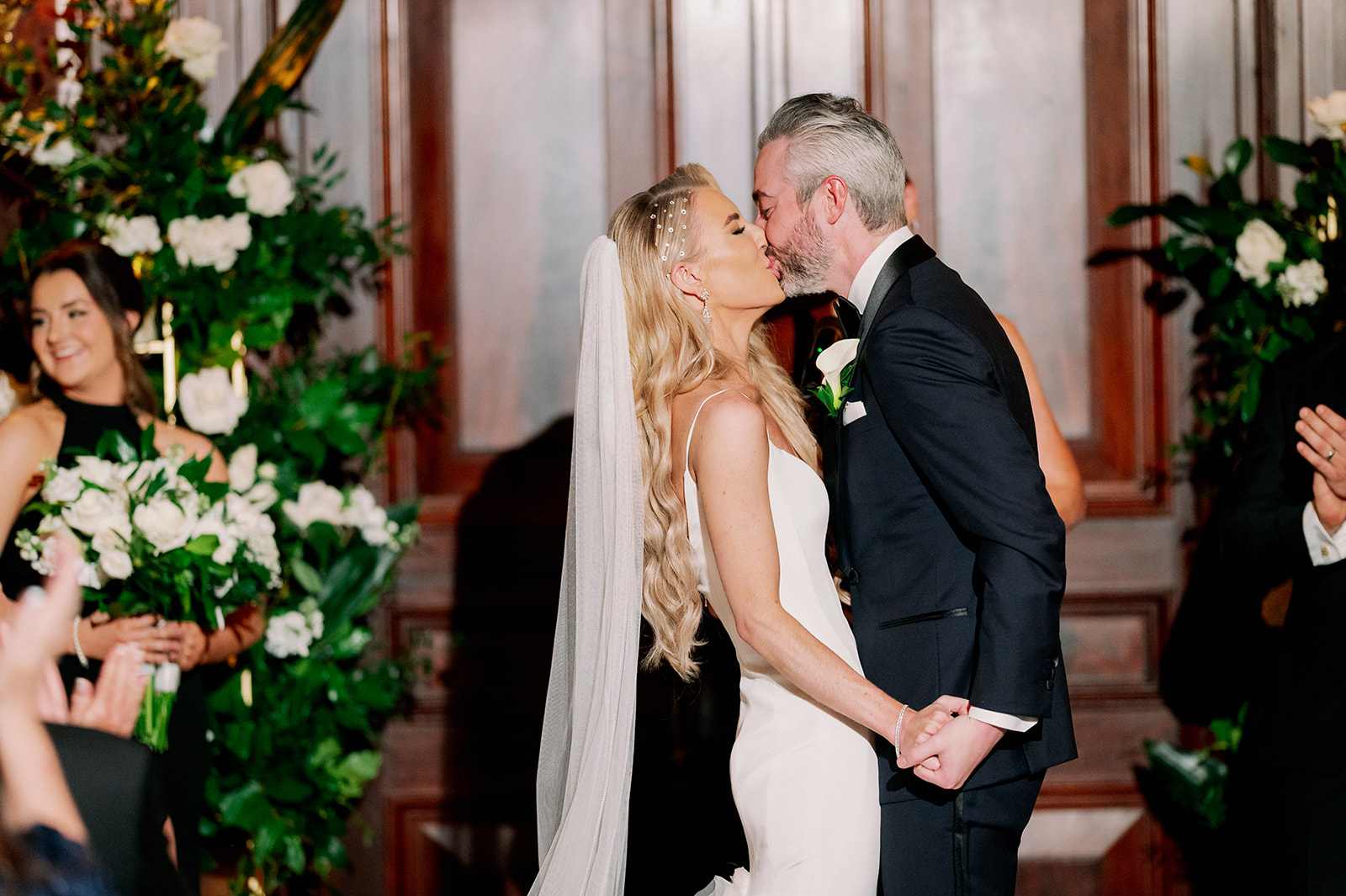 Bourne Mansion indoor wedding ceremony first kiss.
