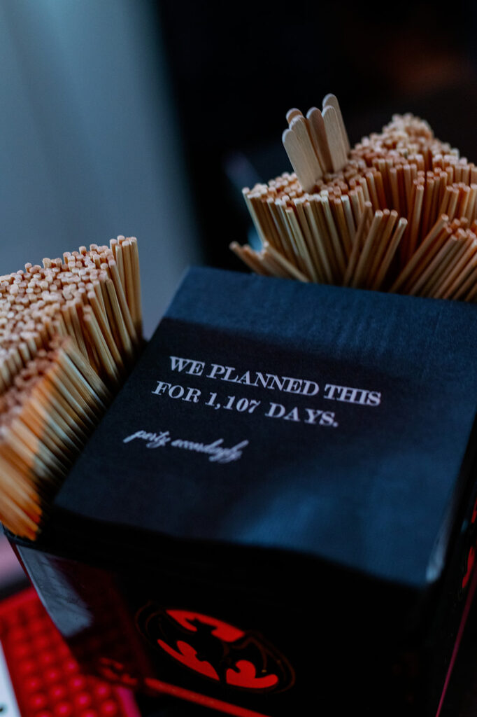 Custom wedding napkins that say "we planned this for 1,107 days"