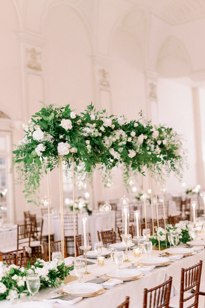 White wedding reception at Bourne Mansion with hanging floral installation.