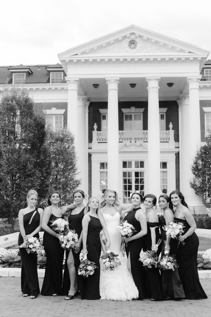 All black bridal party group photo outside the Bourne Mansion.